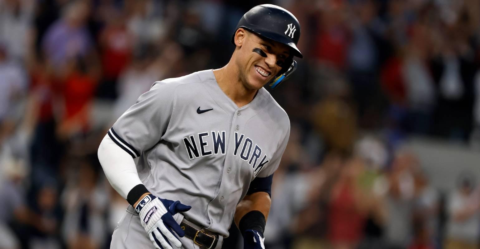 New York Yankees' Aaron Judge smiles after a home run by Yankees