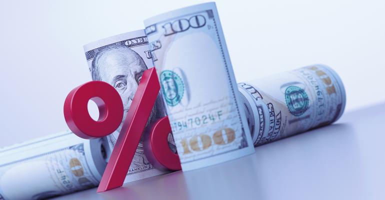 rolls of dollars percent sign wealth management M&A interest rates