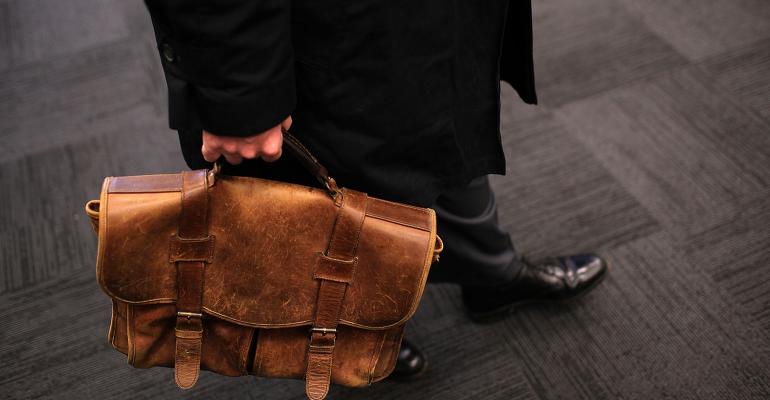 older worker with briefcase