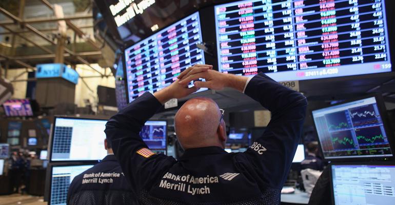 stock market trader hands on head