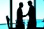 businessmen handshake silhouetted business transition partner