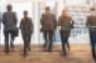 group of young businessmen and women running up stairs pro bono work